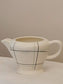 picture of side detail from french vintage milk jug 'Sortilège' series from Salin-les-bains with black and right green lines decoration