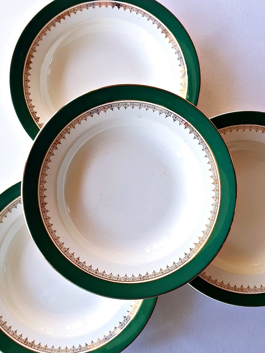 Picture of deep green colored with siver rim vintage plates from Digoin-Sarreguemines, 'Martine' series