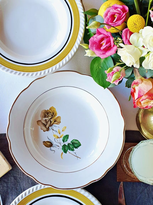 picture of a bouquet of flowers with antique dishes from france with olive and gold colors