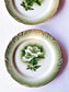 Picture of green vintage dessert plates with anemone flowers and embrossed rim motif from Gien, France