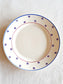 picture of a french vintage dessert plate with blue and red sketch on the rim from lunéville, 'Pierre' series