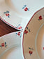 picture of details of flower print red line plate