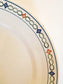 picture of side print details from french vintage serving plate from Saint-Amand with art deco elegant detail in red and blue