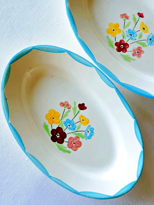 picture of two oval shaped pickle dishes in sky blue color from salin-les-bains, france. hand-painted flowers print, 'joyceline' series