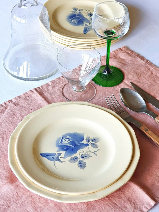 Picture of a dining table setting display with a blue roses vintage dinner plate with art nouveau style glass and green alsace wine glass on a pink linen kitchen cloth