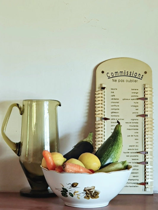 pictue of vintage salad bowl with carrots, eggplant, lemons and vintage yellow pitcher behind