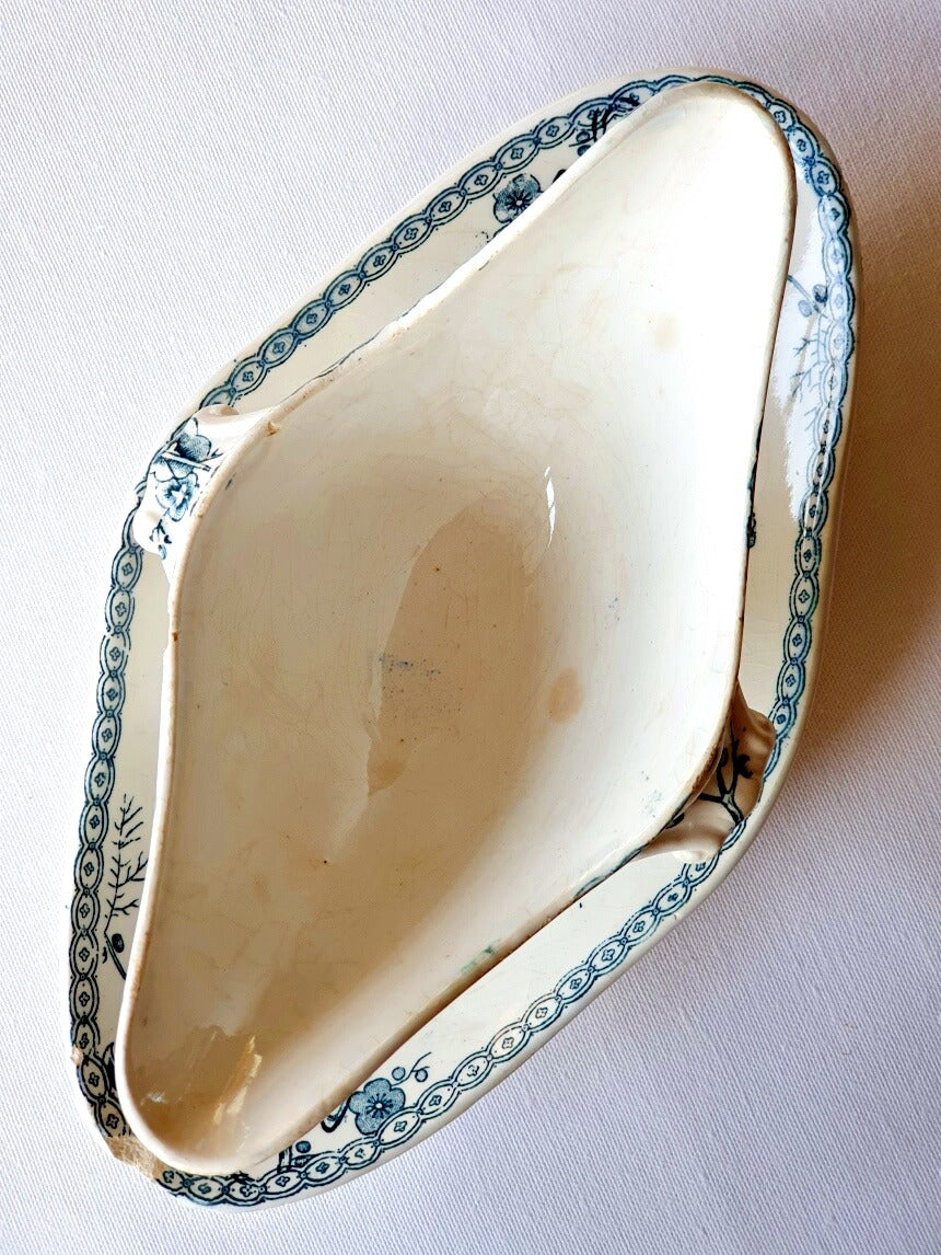 picture of interior detail of a antique sauce boat from 19th century from Gien, 'Fleurette' series