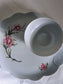 picture of an oversized saucer with porcelain tea cup with pink flower print from couleuvre porcelain manufatory in France