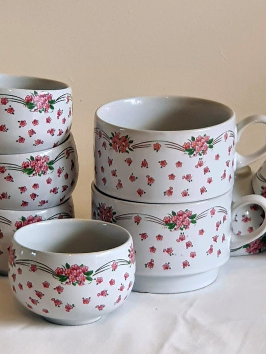 picture of four stacked vintage pink flowers print tea cup without handle and two stacked pink flowers vintage mug with handle